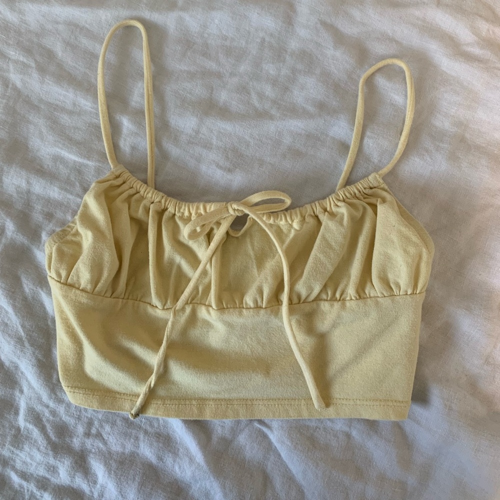 This is a yellow tank top, Great for summer it’s from sky & sparrow